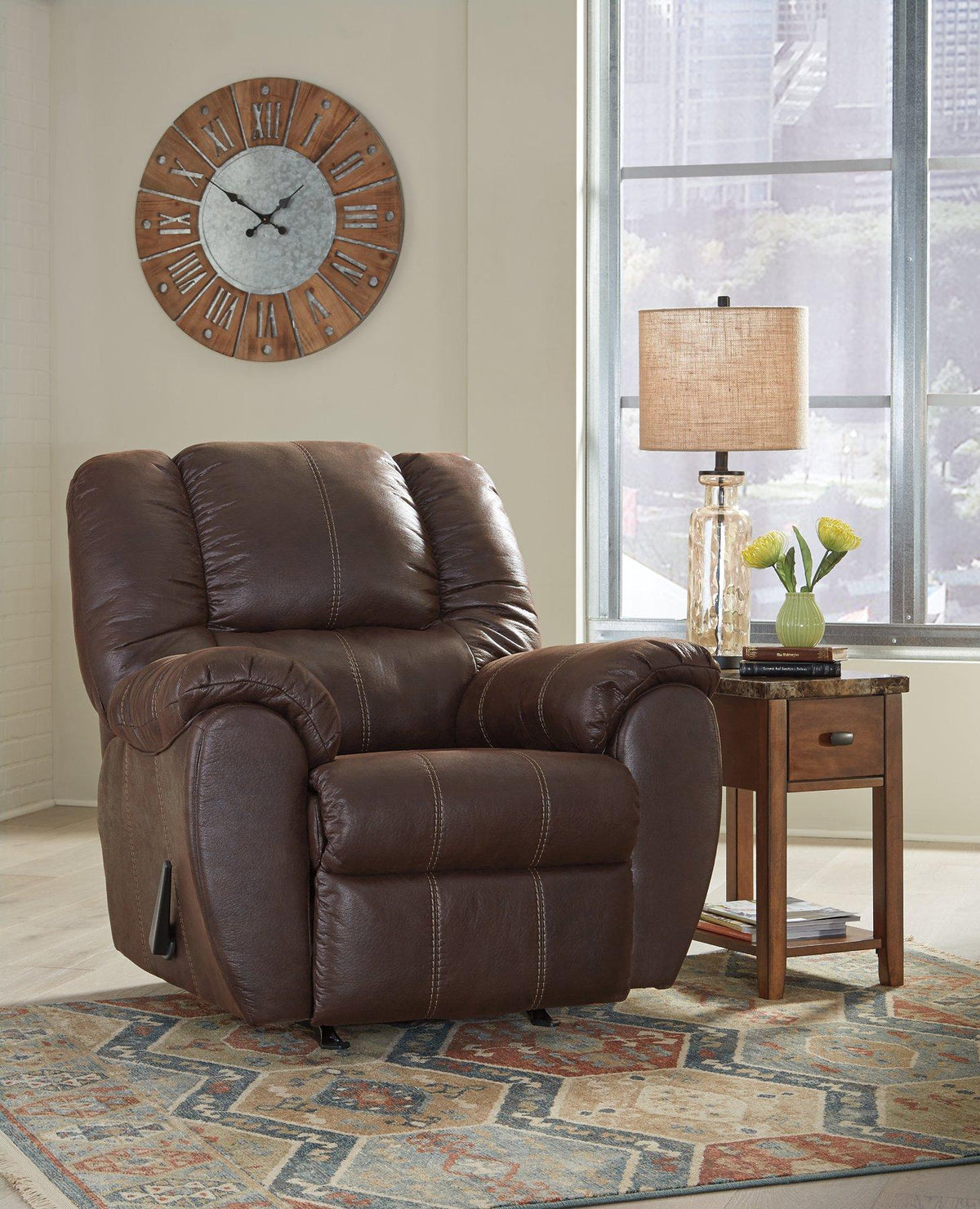 Ashley Furniture McGann recliner in beige fabric, showing plush cushioning and ergonomic design for comfortable seating.