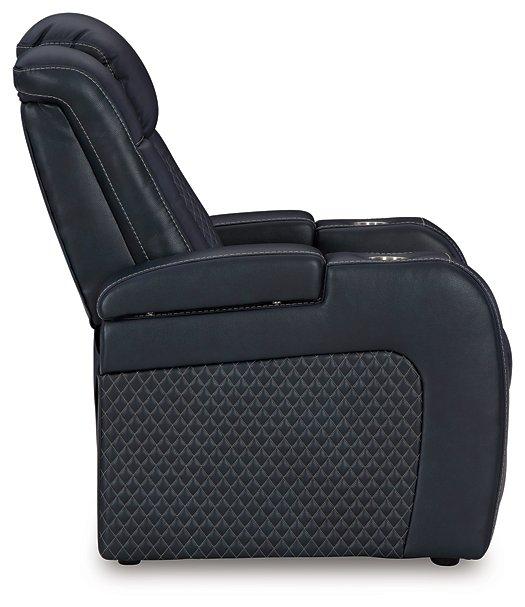 Ashley Furniture Fyne-Dyme Power Recliner shown in dark leather with cushioned armrests and a plush backrest for comfort.