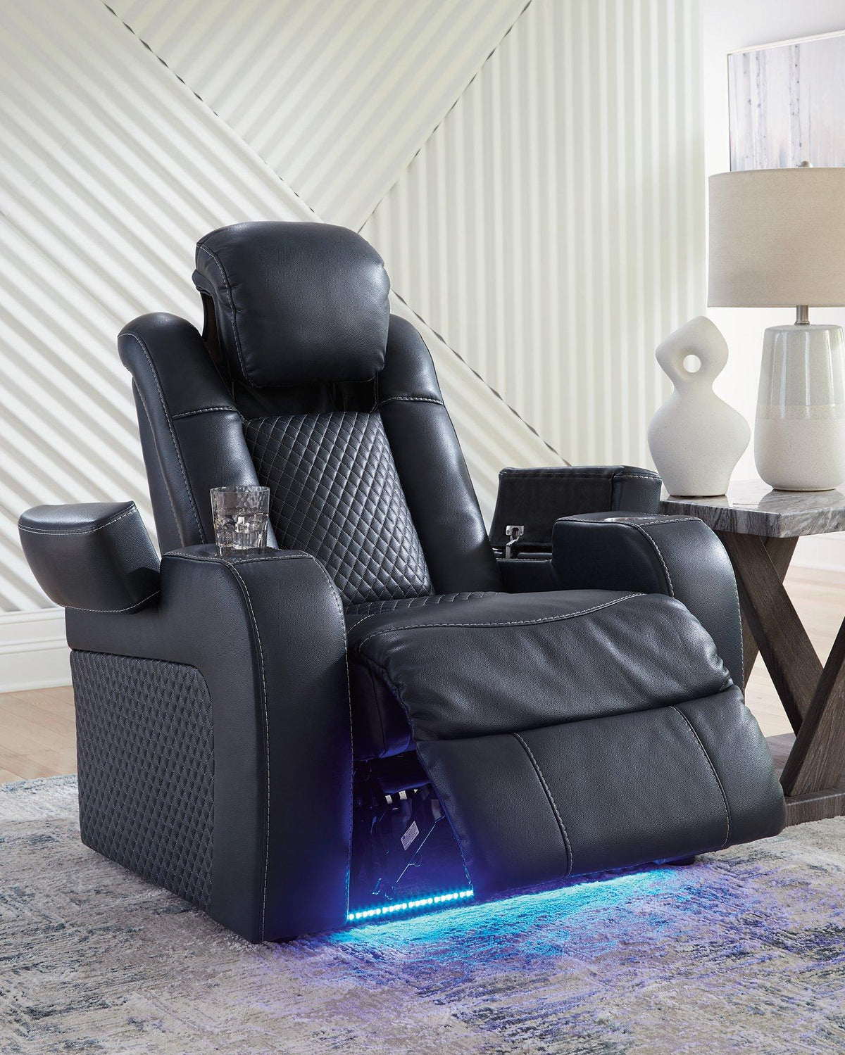 Ashley Furniture Fyne-Dyme Power Recliner showing plush fabric upholstery and a reclining mechanism with armrests.