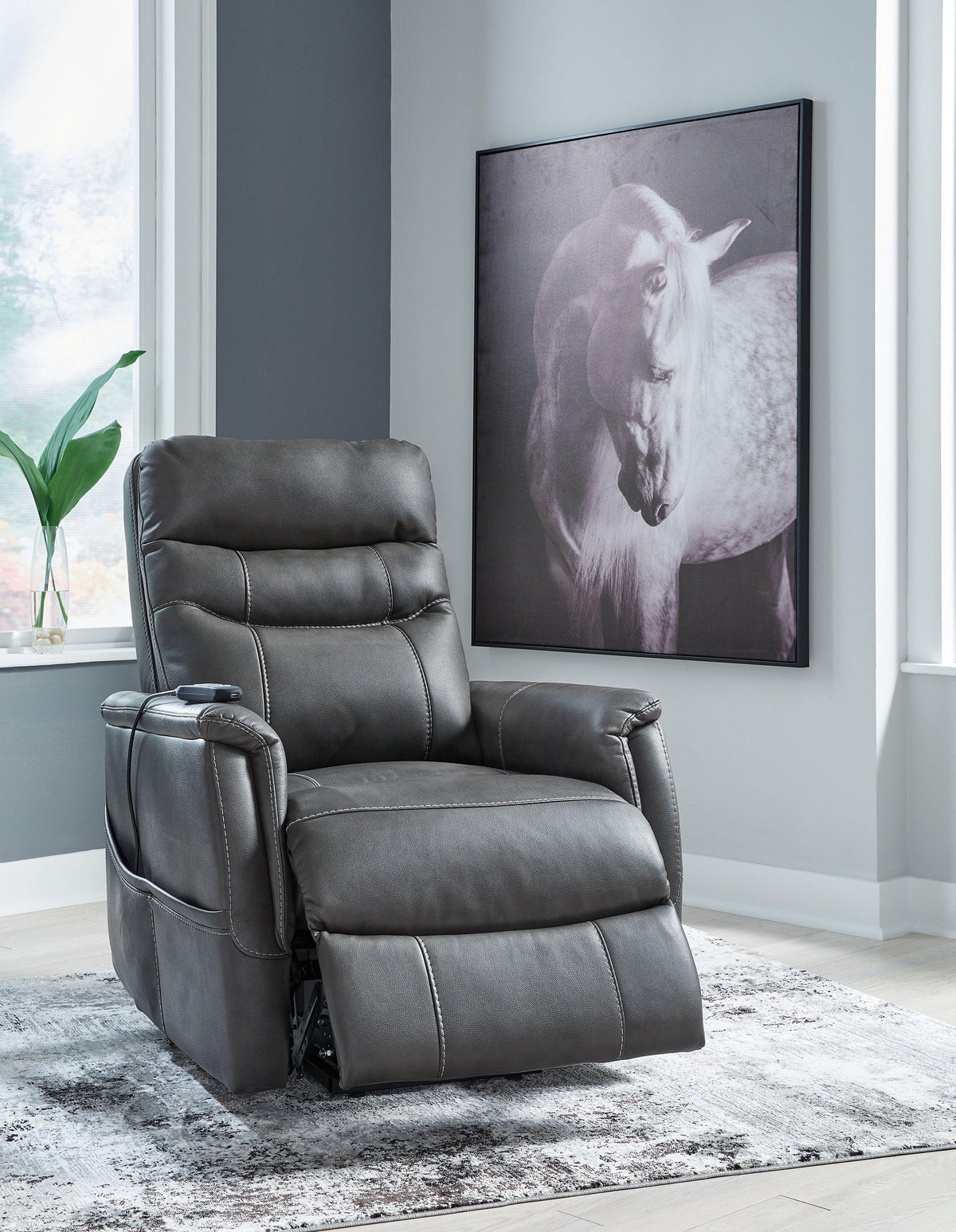 Ashley Furniture Strawbill Power Lift Recliner showing plush fabric upholstery and adjustable reclining mechanism.