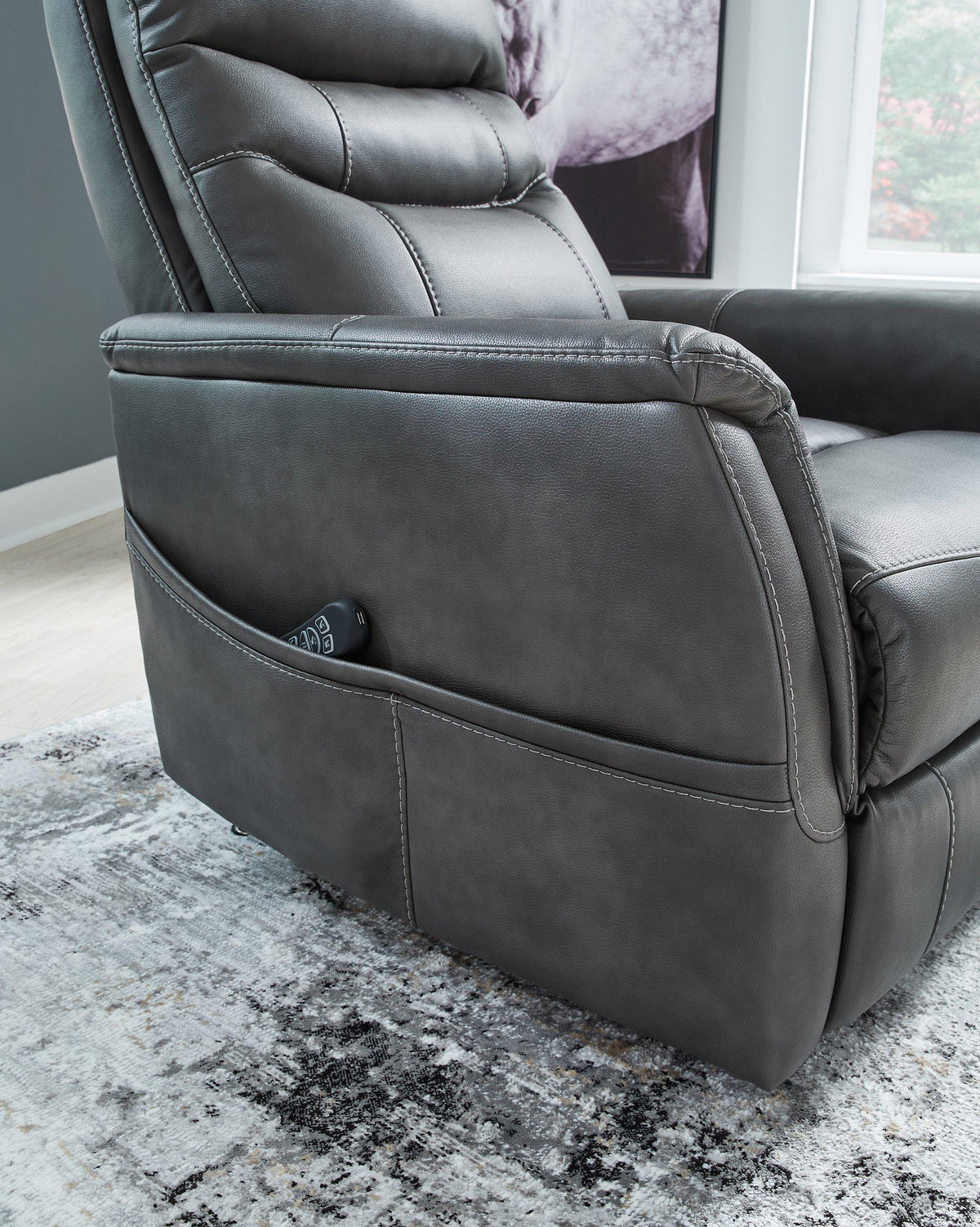 Ashley Furniture Strawbill Power Lift Recliner in beige fabric with plush cushioning and a built-in power reclining mechanism.