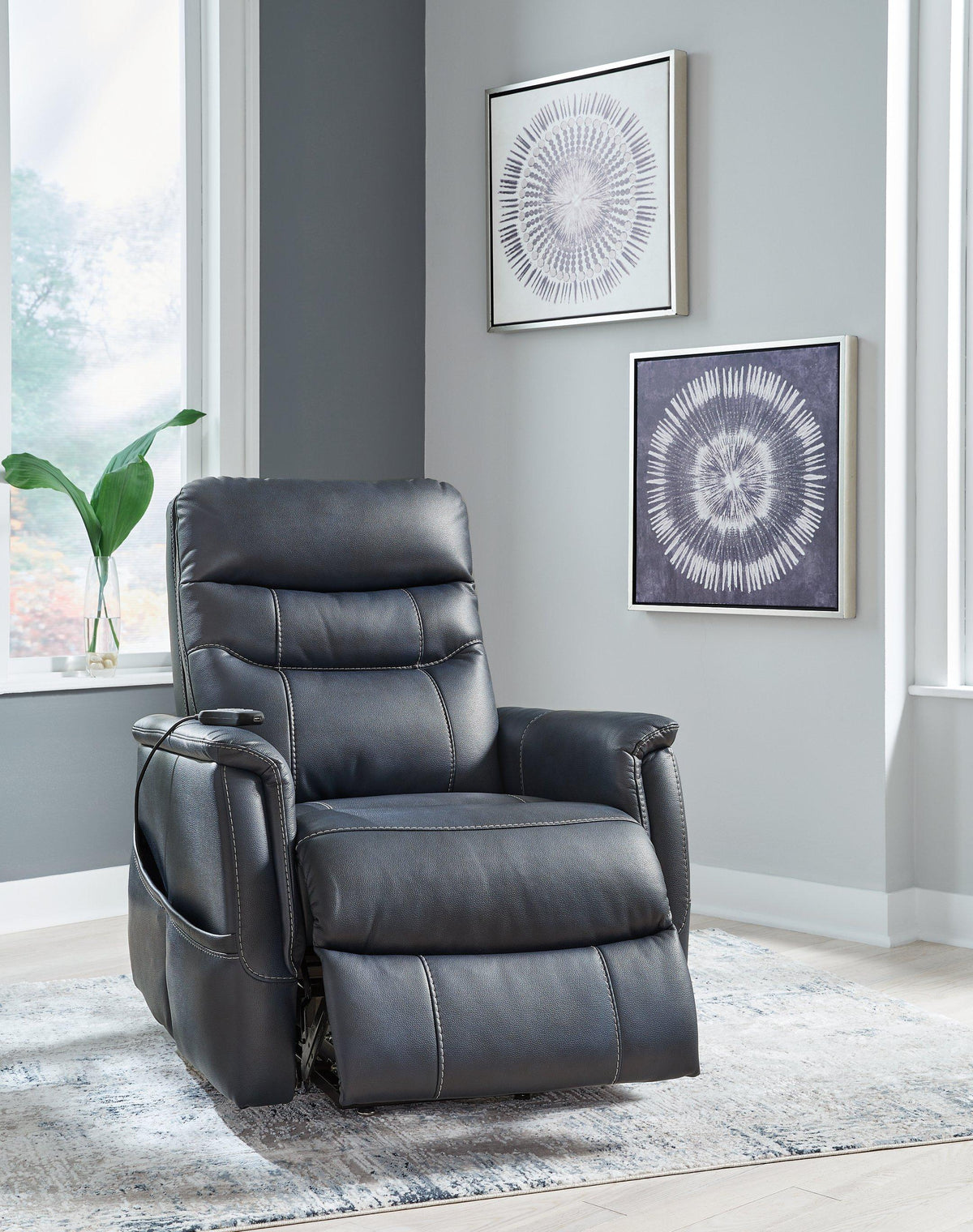 Ashley Furniture Strawbill Power Lift Recliner with plush cushioning and ergonomic design for comfortable seating and easy reclining.