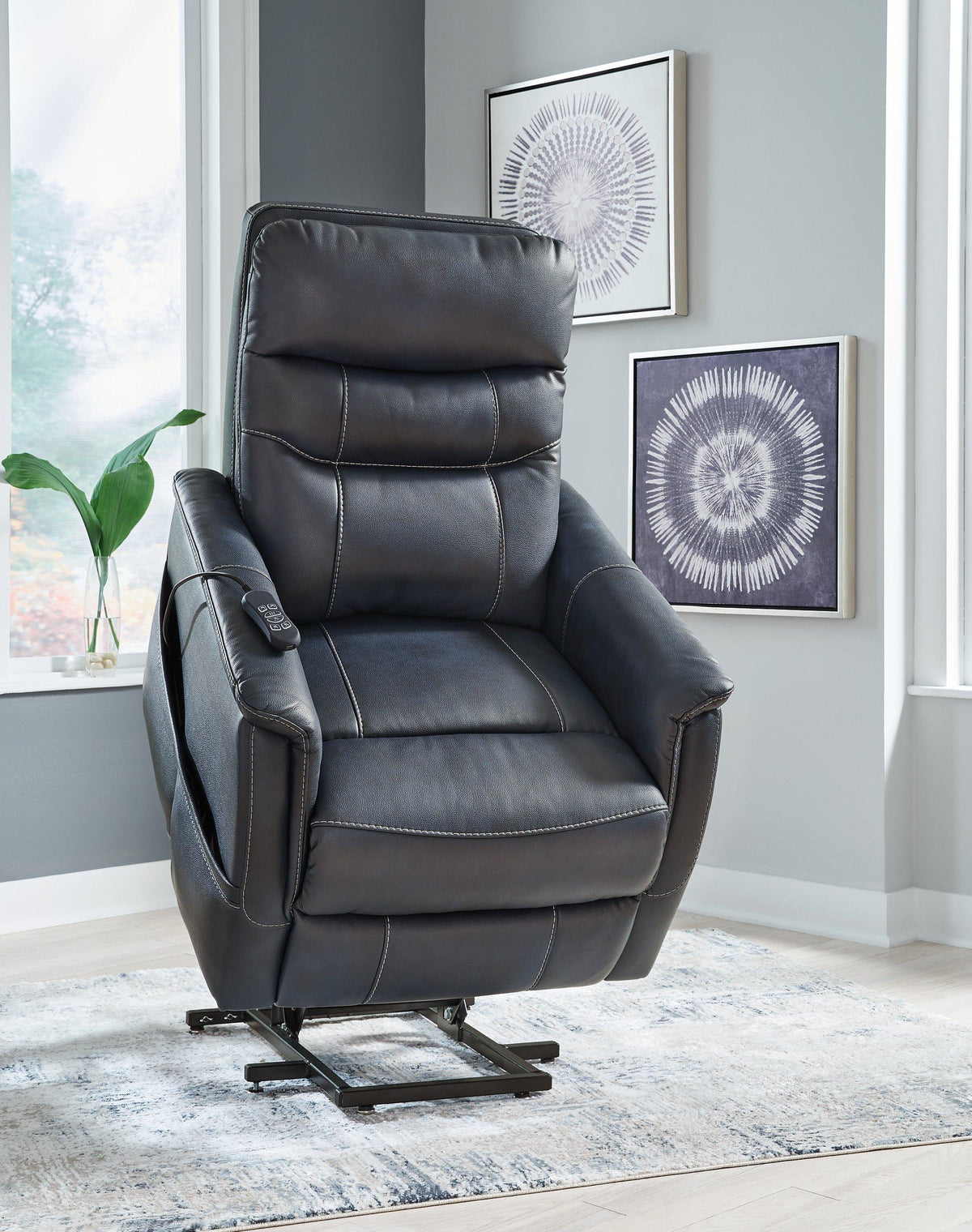 Ashley Furniture Strawbill Power Lift Recliner in beige fabric with plush cushioning and a built-in lift mechanism.