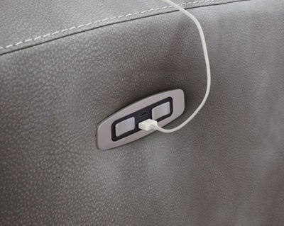 Close-up of Ashley Furniture Next-Gen DuraPella Power Recliner showing detailed upholstery and built-in USB charging port.