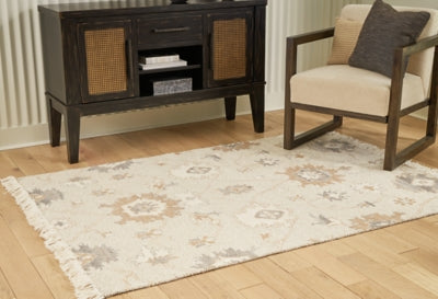 Ashley Furniture Calkin Rug with intricate patterns and neutral tones, ideal for adding style to living room or bedroom decor.