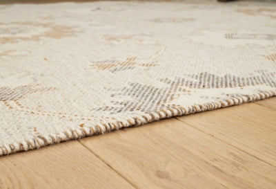 Close-up of the Ashley Furniture Calkin Rug showcasing its intricate pattern and soft texture for cozy home decor.