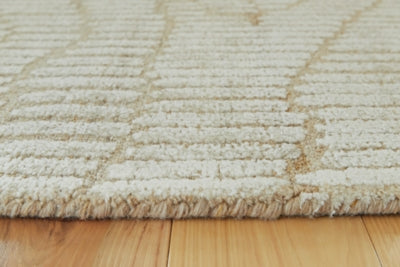 Detailed view of the Ashley Furniture Jaseena area rug featuring intricate patterns and rich colors.