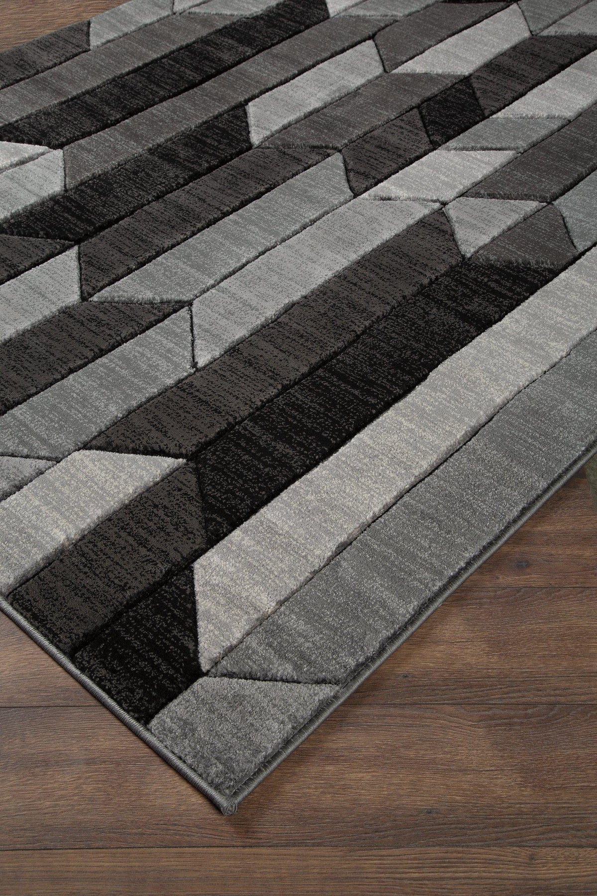 Ashley Furniture Chayse 6'6" x 9'6" rug with intricate patterns in neutral tones, ideal for living room or bedroom decor.