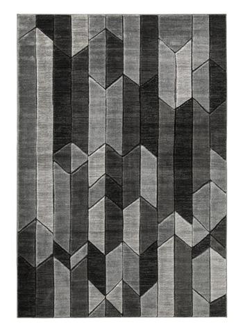 Ashley Furniture Chayse 6'6" x 9'6" rug featuring a detailed pattern in neutral tones, perfect for living room decor.
