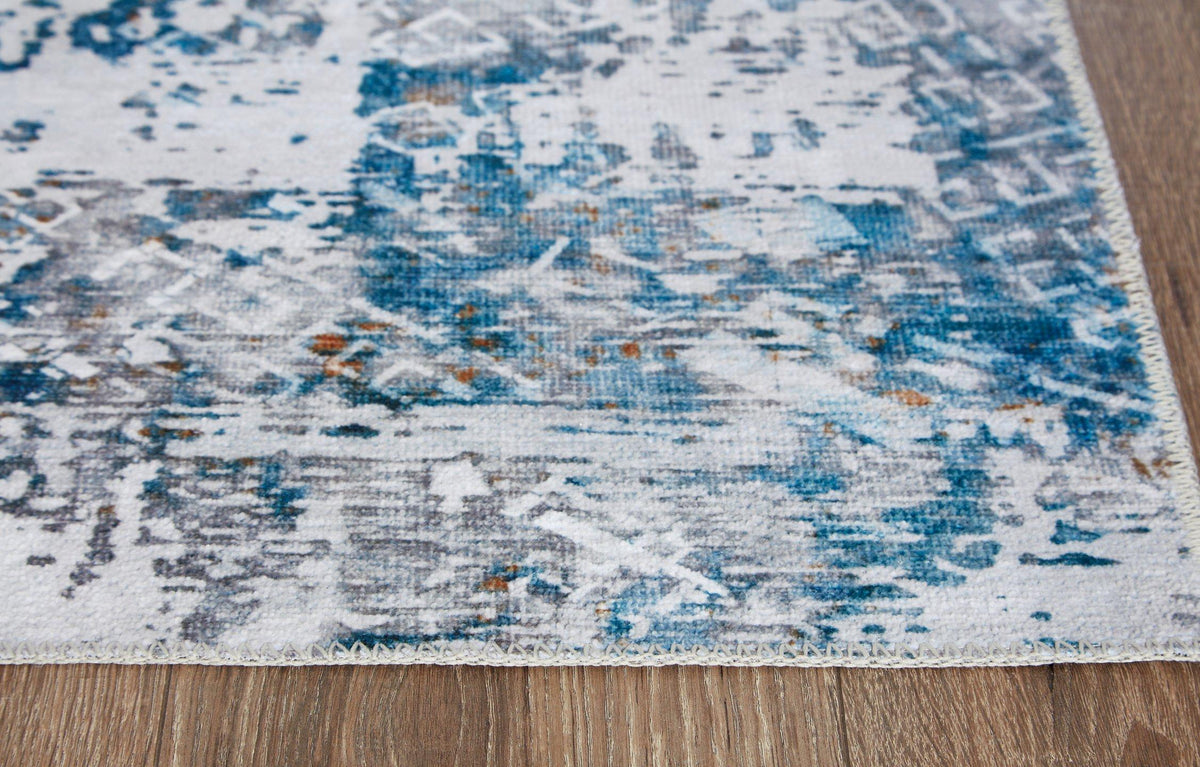 Ashley Furniture Garyard 5' x 7' rug featuring a woven design in neutral tones, perfect for enhancing living room decor.