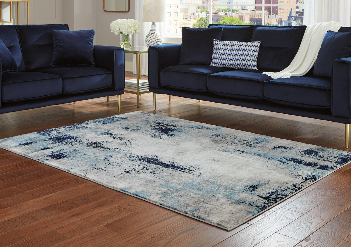 Ashley Furniture Leonelle 5'3" x 7'3" rug featuring a stylish design perfect for living rooms or bedrooms.