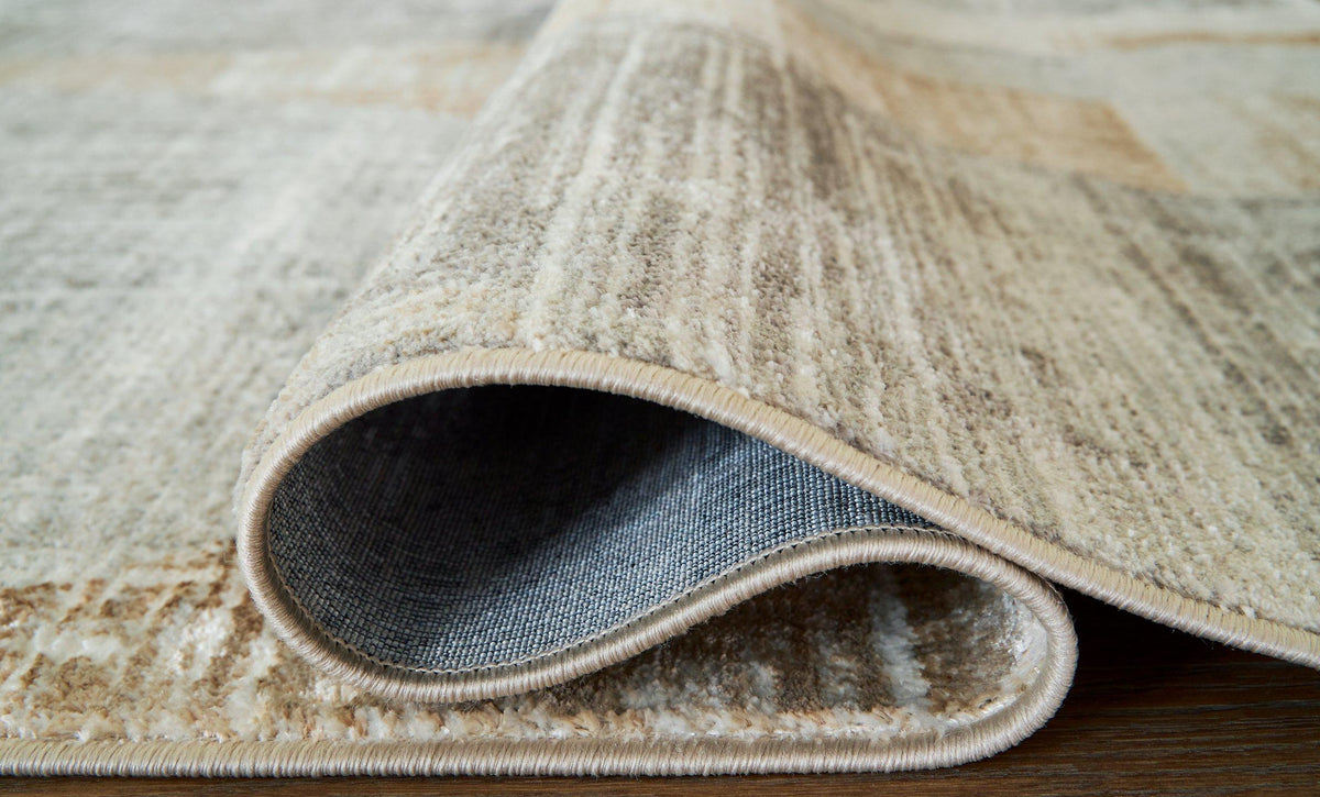 Large Ashley Furniture Truward Rug with intricate pattern, soft texture, and neutral tones for stylish home decor.