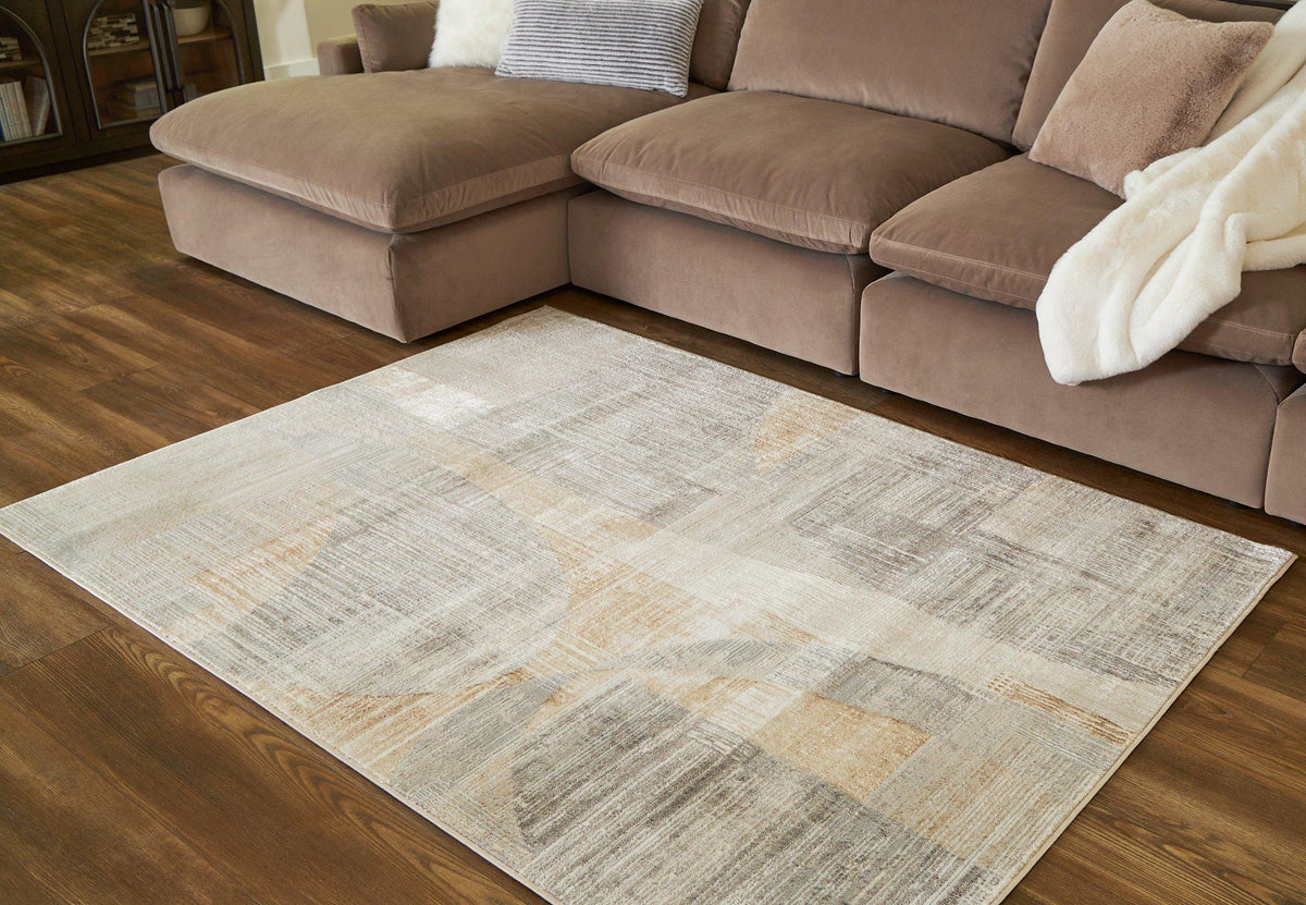 Large Ashley Furniture Truward Rug with intricate patterns and soft texture, ideal for enhancing living room decor.