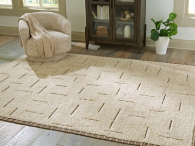 Ashley Furniture Clayman Rug featuring a textured, neutral-colored woven design in a 4x3-foot size for cozy living spaces.
