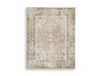 Ashley Furniture Livdon washable rug with a soft, durable fabric in a neutral color, suitable for living rooms or bedrooms.