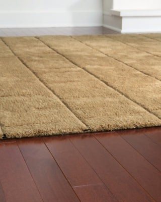 Close-up of the Luzmont Rug by Ashley Furniture, showcasing its detailed woven pattern and soft, textured surface.