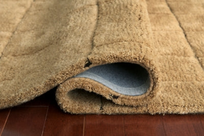 Close-up of Luzmont Rug by Ashley Furniture showing detailed woven pattern and rich texture.