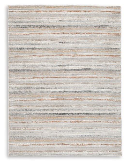 Medium Ashley Furniture Artney Rug with intricate patterns, soft texture, and neutral tones for elegant home decor.