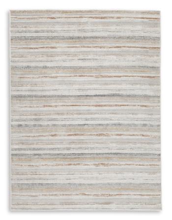 Medium Ashley Furniture Artney Rug with intricate pattern, soft texture, and neutral colors suitable for living room or bedroom decor.