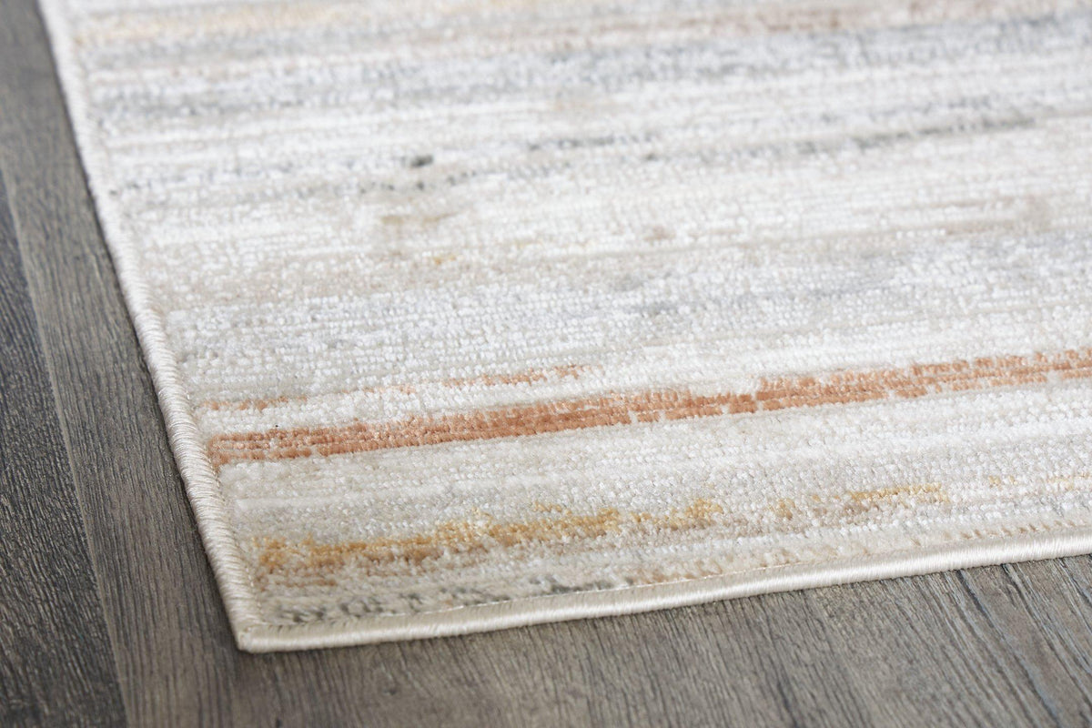 Medium Ashley Furniture Artney Rug with intricate patterns and warm tones, ideal for adding style to living spaces.