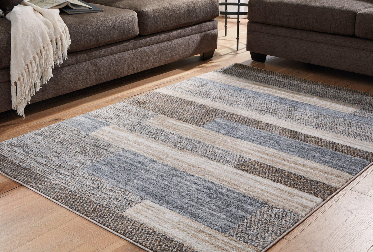 Medium Sethburn Rug by Ashley Furniture featuring a soft, textured design in earthy tones for stylish home decor.
