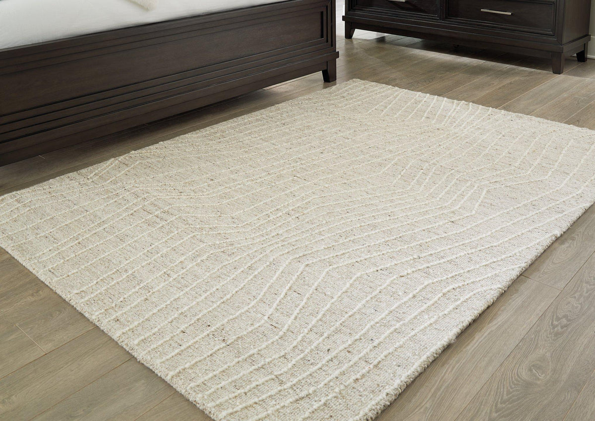 Medium Ashley Furniture Varahill Rug with intricate patterns and soft texture, suitable for living room or bedroom decor.