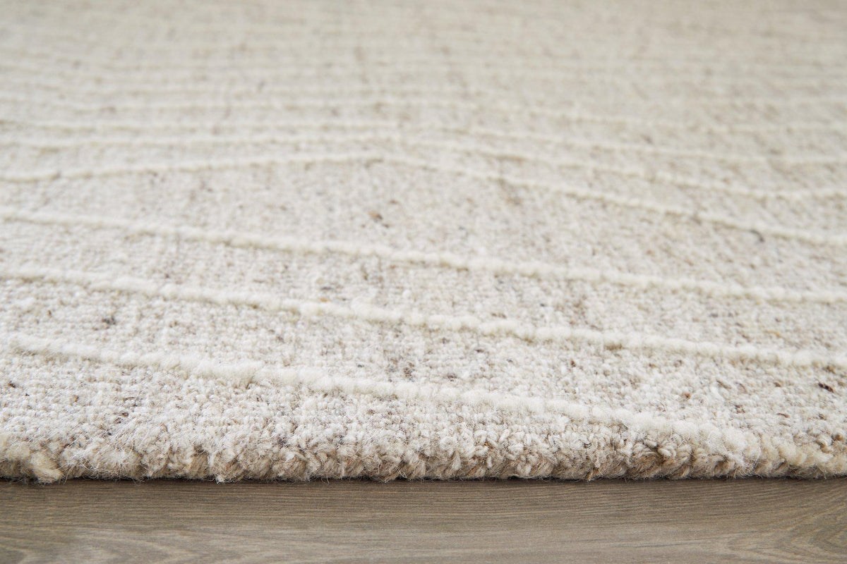 Medium Ashley Furniture Varahill Rug with intricate pattern and soft texture, suitable for living room or bedroom decor.