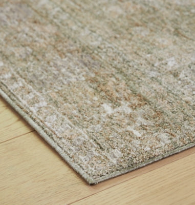 Close-up of Ashley Furniture Neroham Rug showcasing its detailed woven texture and intricate design in neutral tones.