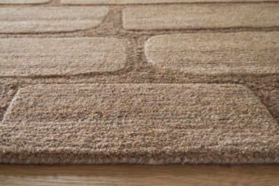 Close-up of the Ashley Furniture Orest Rug showing intricate woven pattern and soft, textured surface.