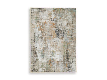 Ashley Furniture Torinette Rug with intricate pattern in neutral tones, showcasing soft fabric and decorative design.