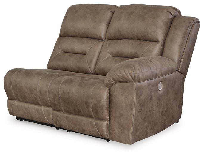 Ashley Furniture Ravenel power reclining sectional with plush cushions and reclining seats in a modern living room setting.