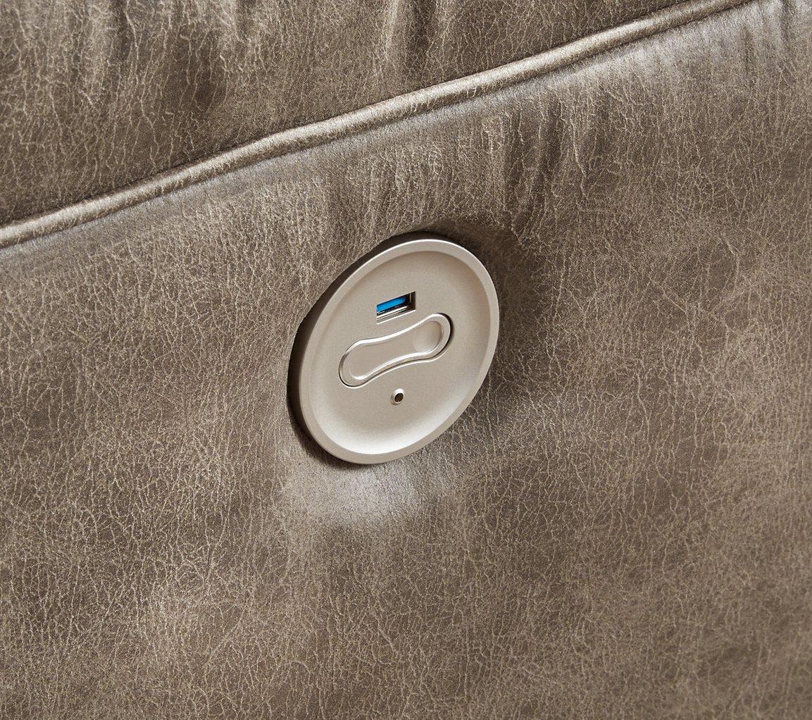 Ashley Furniture Ravenel power reclining sectional with plush cushions and dark upholstery, designed for comfortable lounging.