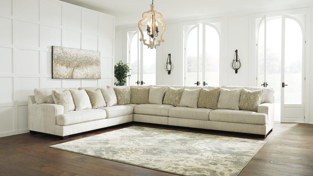 Ashley Furniture Rawcliffe sectional sofa with plush cushions and modern design in a spacious living room setting.