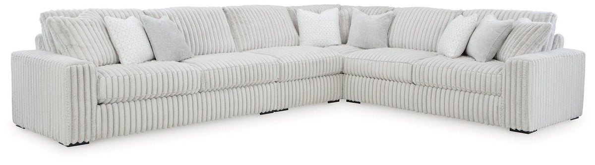 Ashley Furniture Stupendous Sectional sofa with plush cushions and modern design, shown in a cozy living room setting.