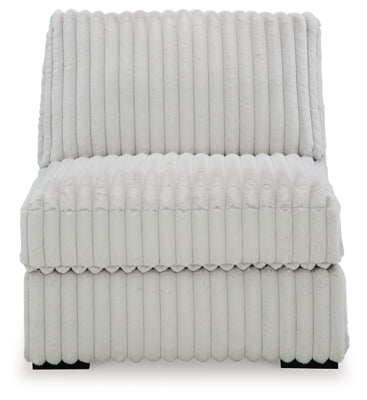 Ashley Furniture Stupendous sectional sofa with plush cushions and modern design, viewed head-on from the side.