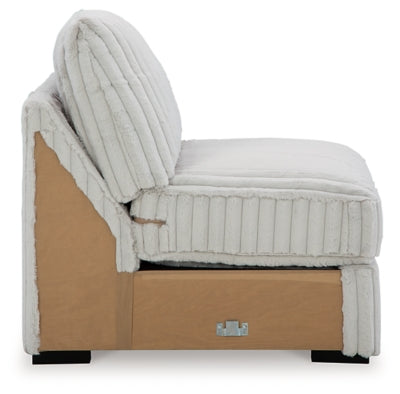 Ashley Furniture Stupendous sectional sofa with plush cushions and modern design, shown from a side angle.