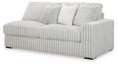 Ashley Furniture Stupendous Sectional sofa shown from an angled view, featuring plush cushions and modern design.