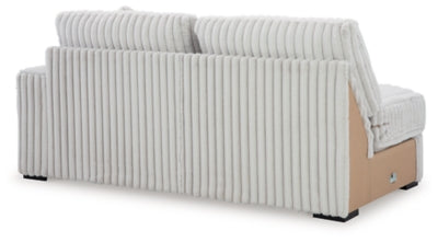 Ashley Furniture Stupendous sectional sofa shown from the back, featuring plush cushions and stylish upholstery.