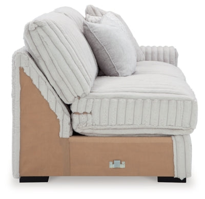 Ashley Furniture Stupendous sectional with beige fabric, featuring plush cushions and modern design for comfortable living space.