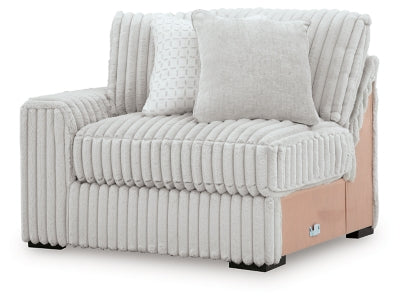 Ashley Furniture Stupendous sectional sofa with beige upholstery, shown from an angled view in a modern living room setting.
