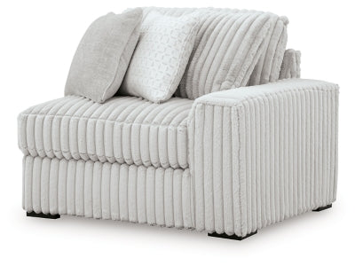Ashley Furniture Stupendous sectional sofa shown from an angled view with plush cushions and modern design.