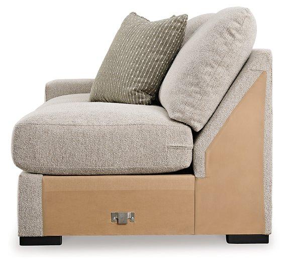 Ashley Furniture Ballyton sectional sofa with plush cushions and neutral fabric, perfect for modern living rooms.