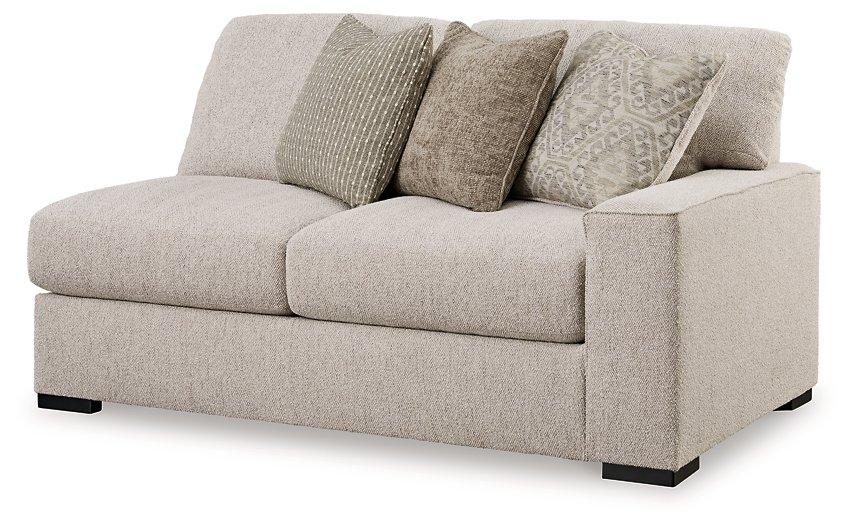 Ashley Furniture Ballyton sectional sofa with plush cushions and neutral fabric, perfect for modern living rooms.