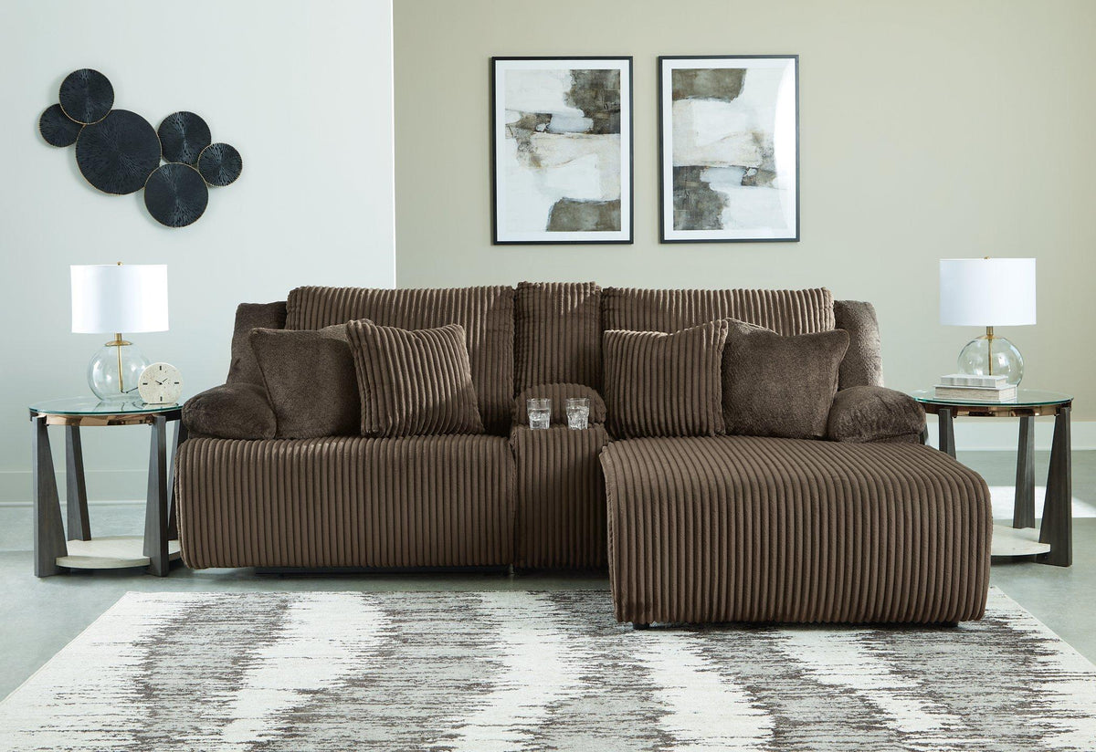 Ashley Furniture Top Tier Reclining Sectional Sofa with Chaise, plush fabric, and reclining features for comfortable lounging.