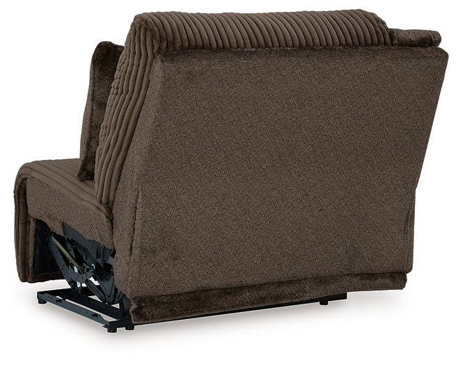 Ashley Furniture Top Tier reclining sectional sofa with chaise, featuring plush cushions and modern design in a living room setting