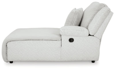 Ashley Furniture top tier reclining sectional sofa with chaise, featuring plush cushions and modern design, shown from side view.