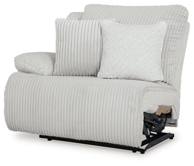 Ashley Furniture Top Tier reclining sectional sofa with chaise, featuring plush cushions and a modern design, shown from an angled view.