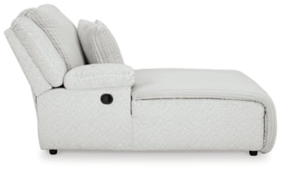 Ashley Furniture Top Tier reclining sectional sofa with chaise, featuring plush cushions and modern design in neutral fabric.
