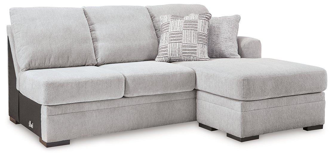 Ashley Furniture Gabyleigh sectional with chaise, showcasing plush fabric and modern design in a spacious living room setting.