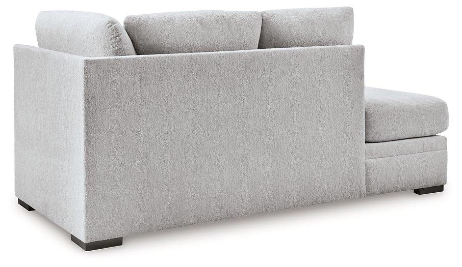 Ashley Furniture Gabyleigh sectional with chaise showing plush fabric, modern design, and spacious seating in a stylish living room setting.